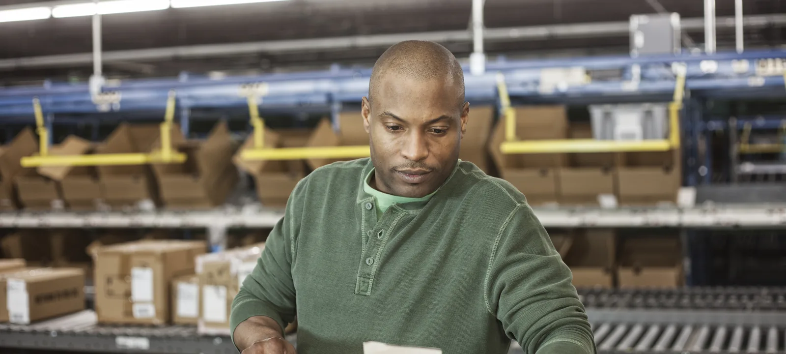 Warehouse specialist checking labels and order paperwork
